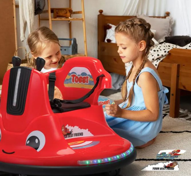 Two children are playing with baby bumper car.