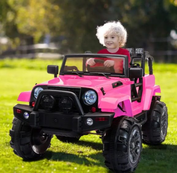 A kid is riding the kids ride on car.