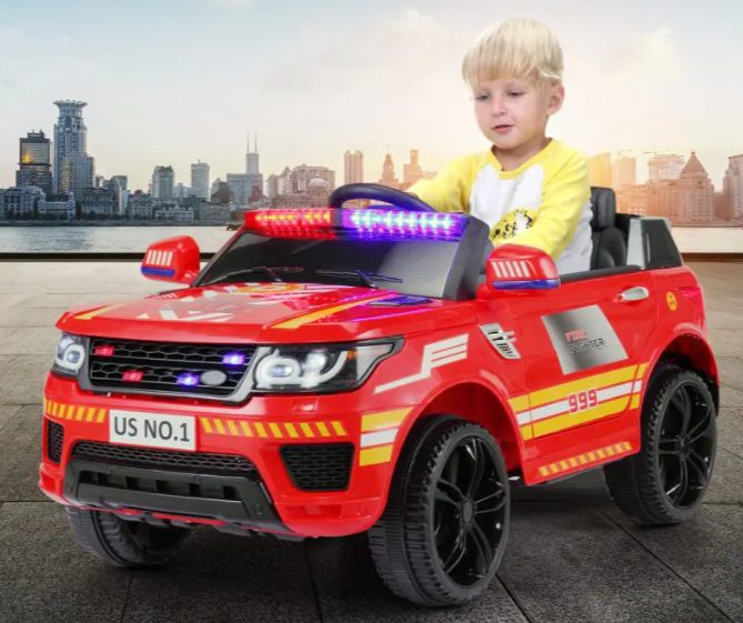 A child is riding the ride on police car.