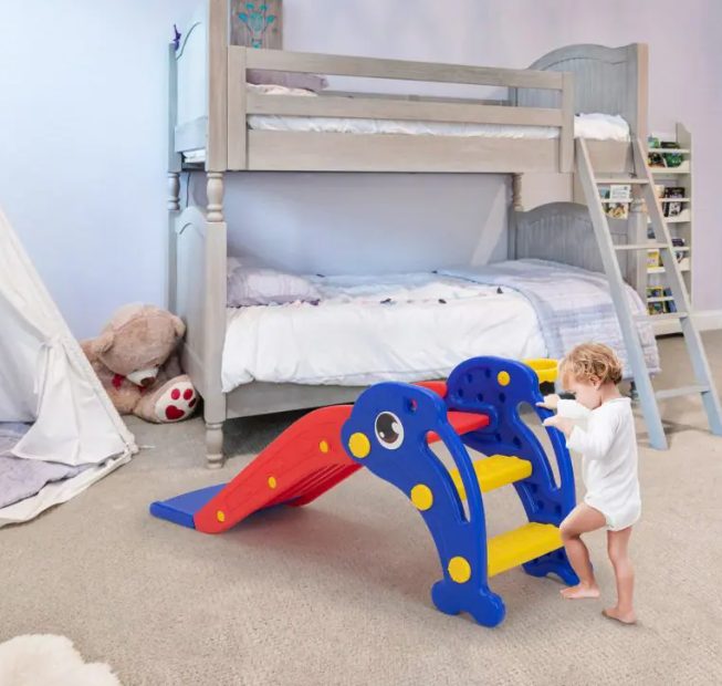 A kid is playing with kids slide.