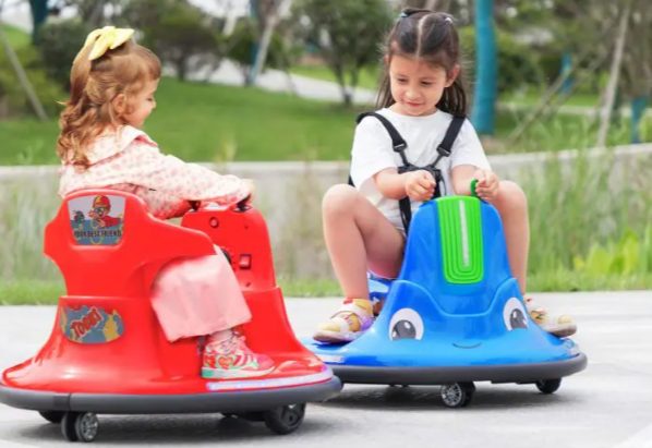 Kids are playing with bumper cars for kids.