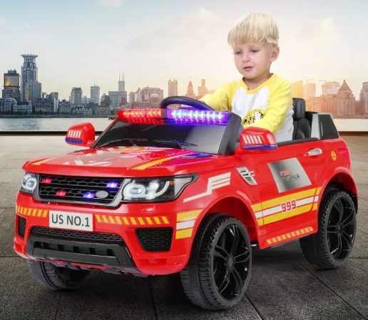 A kid is riding the ride on police car.