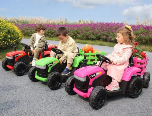Kids are riding the tractors for kids.