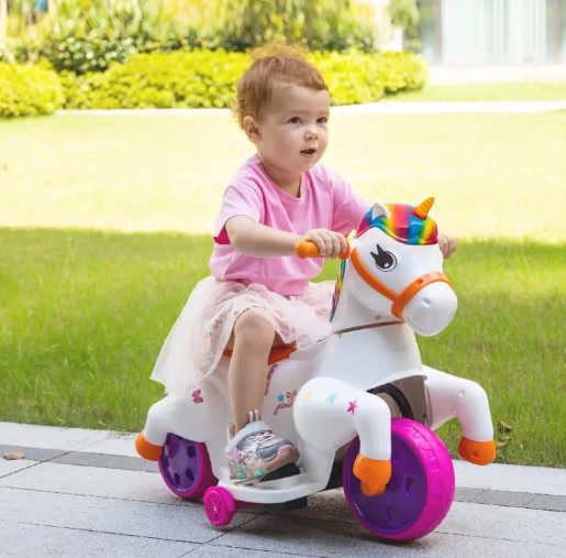 A kid is playing with unicorn ride on toy.