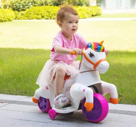 A kid is riding the unicorn ride on toy.