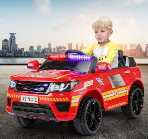 A kid is riding the ride on police car.