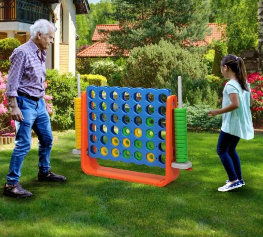 Kids are playing with jumbo 4 to score.
